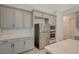 Kitchen with gray cabinets, stainless steel appliances, and light quartz countertops at 195 Cactus Sunrise St, Las Vegas, NV 89138