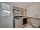 Bright laundry room featuring modern appliances and ample storage space, perfect for efficient home management at 195 Cactus Sunrise St, Las Vegas, NV 89138