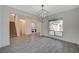 Bright living room featuring tiled floors, modern lighting, and a staircase at 195 Cactus Sunrise St, Las Vegas, NV 89138