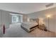 Spacious main bedroom features plush carpet, natural light, and a neutral color palette at 195 Cactus Sunrise St, Las Vegas, NV 89138