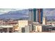 Dynamic cityscape view featuring a modern high-rise against a backdrop of mountains at 200 Hoover Ave # 1210, Las Vegas, NV 89101