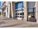 Modern building entrance with glass doors and windows, featuring architectural concrete accents at 200 Hoover Ave # 1210, Las Vegas, NV 89101