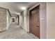 Hallway featuring unit doors, modern lighting, and neutral tones, creating an inviting and stylish entryway at 200 Hoover Ave # 1210, Las Vegas, NV 89101