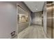 Hallway showcasing a unit entrance, elevator access, and contemporary design elements for a stylish living experience at 200 Hoover Ave # 1210, Las Vegas, NV 89101
