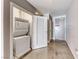 Convenient laundry area with stacked washer and dryer, and added storage at 200 Hoover Ave # 1210, Las Vegas, NV 89101