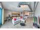 Bright, open-concept living space with industrial-style ductwork, city views, and comfortable furnishings, ideal for modern living at 200 Hoover Ave # 1210, Las Vegas, NV 89101