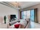 Inviting living room with cityscape views, comfortable seating, and a sleek entertainment center for modern living at 200 Hoover Ave # 1210, Las Vegas, NV 89101