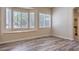 Bedroom featuring hardwood flooring, a ceiling fan and a window bench with plantation shutters at 2020 Sinfonia Ave, Henderson, NV 89052