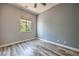 This bedroom has beautiful wood floors and a window view at 2020 Sinfonia Ave, Henderson, NV 89052