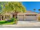 Charming single-story home featuring a well-manicured lawn, mature tree, and a two-car garage at 2020 Sinfonia Ave, Henderson, NV 89052