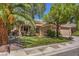 Inviting single-level home with mature landscaping, a green lawn, and a convenient two-car garage at 2020 Sinfonia Ave, Henderson, NV 89052