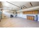 Spacious garage featuring ample storage cabinets, work bench, and epoxy floor at 2020 Sinfonia Ave, Henderson, NV 89052
