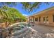 Beautiful backyard oasis featuring a pool, rock waterfall, spa and landscaped yard at 2020 Sinfonia Ave, Henderson, NV 89052
