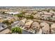 Aerial view of a residential neighborhood with well-maintained homes, trees, and landscaping at 2199 Timescape Ct, Las Vegas, NV 89123