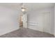 Bright bedroom with a ceiling fan, carpet flooring, and closet with sliding doors at 2199 Timescape Ct, Las Vegas, NV 89123