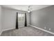 Neutral bedroom with carpet, ceiling fan, and a window for natural light at 2199 Timescape Ct, Las Vegas, NV 89123