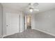 Clean bedroom with carpet flooring, ceiling fan, and closet with sliding doors at 2199 Timescape Ct, Las Vegas, NV 89123