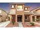 Charming two-story home featuring a well-kept yard and inviting front porch with a comfortable bench at 2199 Timescape Ct, Las Vegas, NV 89123