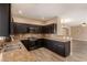 Well-equipped kitchen features dark cabinetry, stainless steel appliances, and granite countertops at 2199 Timescape Ct, Las Vegas, NV 89123
