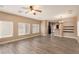 Bright, open living space with neutral tones and tile flooring, leading to the kitchen at 2199 Timescape Ct, Las Vegas, NV 89123