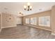 Bright living room features tile flooring, large windows, and neutral paint at 2199 Timescape Ct, Las Vegas, NV 89123
