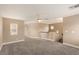 Spacious loft area featuring neutral paint, carpet, and a ceiling fan at 2199 Timescape Ct, Las Vegas, NV 89123