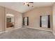 Unfurnished main bedroom with carpet, ceiling fan, and ensuite bath entrance at 2199 Timescape Ct, Las Vegas, NV 89123