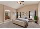 Relaxing main bedroom featuring vaulted ceiling, ceiling fan, and ensuite bath at 2199 Timescape Ct, Las Vegas, NV 89123