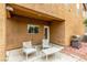 Covered outdoor patio with modern patio furniture and a grill, perfect for entertaining at 2199 Timescape Ct, Las Vegas, NV 89123