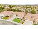 An aerial view showcasing a well-maintained home with a landscaped front yard and neighborhood charm at 2295 Aria Dr, Henderson, NV 89052