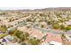 An aerial view showcasing a well-maintained home with a decorative hardscape design and mature landscaping at 2295 Aria Dr, Henderson, NV 89052