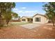 Expansive backyard with a decorative brick and turf paver design at 2295 Aria Dr, Henderson, NV 89052