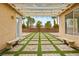 Backyard featuring pavers, string lights, desert landscaping, and benches at 2295 Aria Dr, Henderson, NV 89052