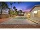Backyard featuring pavers, string lights, and desert landscaping at 2295 Aria Dr, Henderson, NV 89052