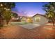 Large backyard featuring manicured landscaping, a patio, and a beautiful desert landscape at 2295 Aria Dr, Henderson, NV 89052
