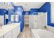 Stylish bathroom with dual sinks, ample counter space, a soaking tub, and a separate shower for a spa-like experience at 2295 Aria Dr, Henderson, NV 89052