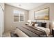 Cozy bedroom with neutral decor and a large window with blinds at 2295 Aria Dr, Henderson, NV 89052