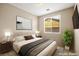 Cozy bedroom featuring a comfortable bed, stylish furniture, and a bright window at 2295 Aria Dr, Henderson, NV 89052