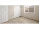 Bedroom with light wood tile flooring and a double closet at 2295 Aria Dr, Henderson, NV 89052