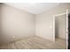 Bedroom featuring light wood tile flooring and closet at 2295 Aria Dr, Henderson, NV 89052