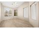 Bedroom with wood-look floors, ceiling fan, and windows with light-filtering blinds at 2295 Aria Dr, Henderson, NV 89052