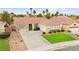 Charming single-story home with a well-manicured lawn and a three-car garage at 2295 Aria Dr, Henderson, NV 89052