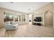 Spacious living room with large windows, hardwood floors, and a cozy seating area at 2295 Aria Dr, Henderson, NV 89052