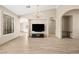 A naturally lit living room with wood-look floors and modern fixtures and furnishings at 2295 Aria Dr, Henderson, NV 89052