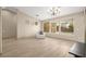Open living room with high ceilings, ample natural light, and a stylish chandelier at 2295 Aria Dr, Henderson, NV 89052