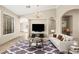 Virtually staged living room showcasing the layout with stylish furniture and decor at 2295 Aria Dr, Henderson, NV 89052