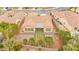 This beautiful backyard boasts a decorative hardscape design and mature landscaping at 2295 Aria Dr, Henderson, NV 89052