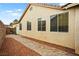 Side yard view with desert landscaping and brick paver path at 2295 Aria Dr, Henderson, NV 89052