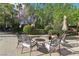 Cozy backyard featuring a stone fire pit with comfortable seating, perfect for outdoor gatherings and relaxation at 2323 Carinth Way, Henderson, NV 89074