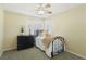 Comfortable bedroom with ceiling fan, shuttered windows and decorative accents at 2323 Carinth Way, Henderson, NV 89074